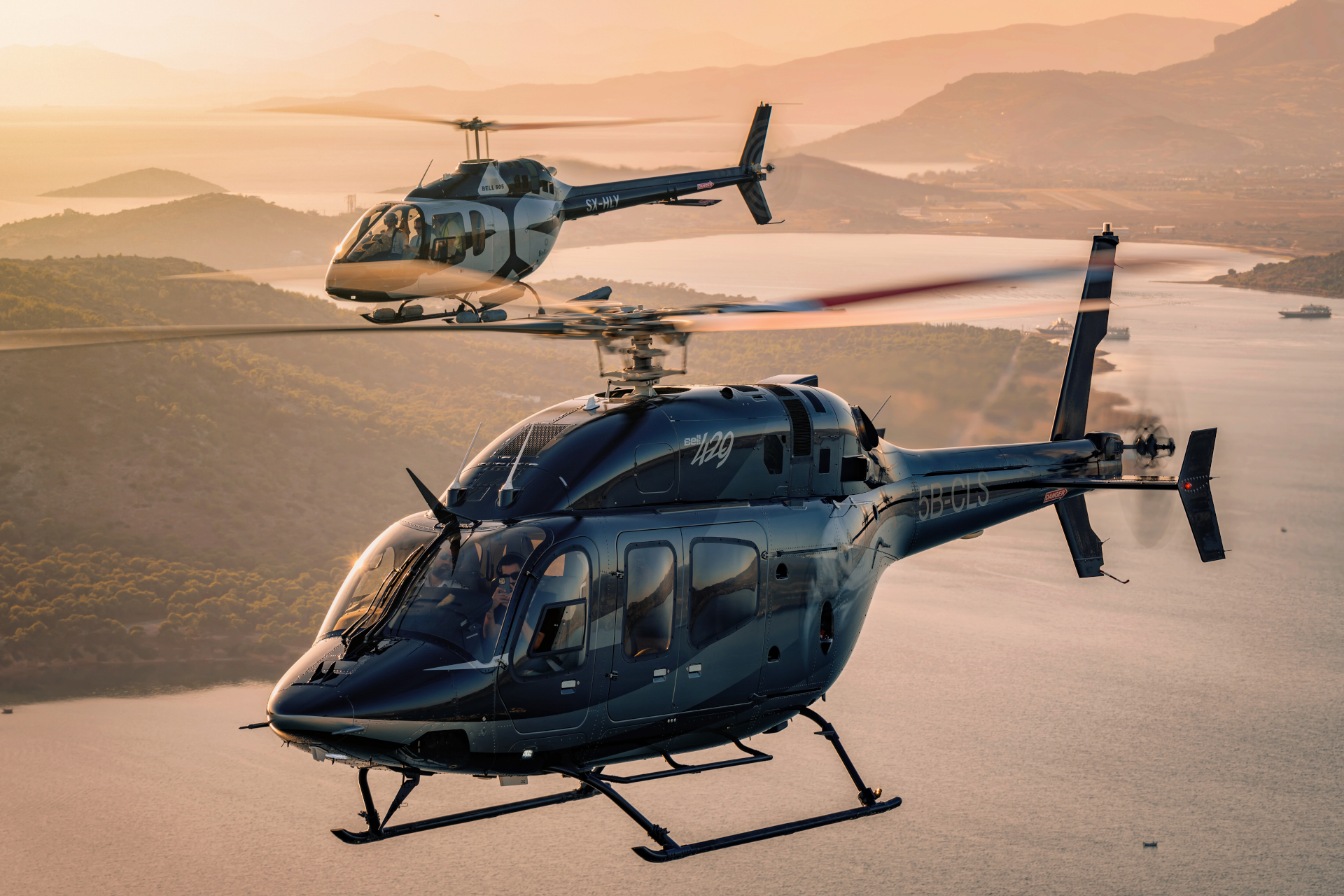 Helicopters BELL 429, BELL 505 on sunset