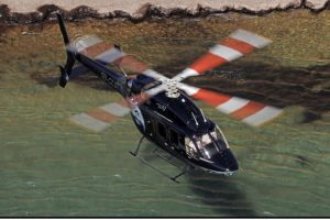 Bell 429 σε πτήση με φόντο παραλία